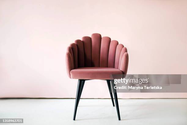pink textured velor armchair on a pink background. - quilted stock pictures, royalty-free photos & images
