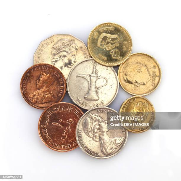 different coins collection on white background - numismatik stock-fotos und bilder