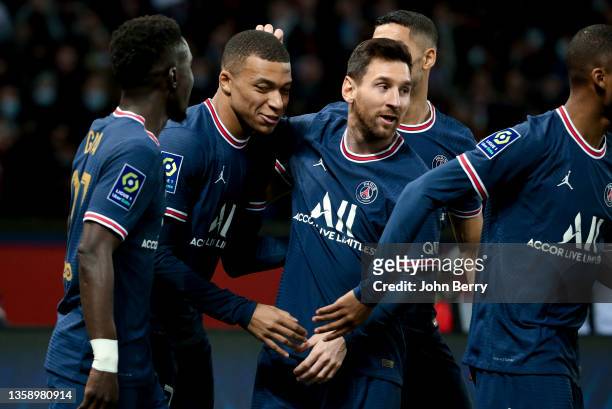 Kylian Mbappe of PSG celebrates his goal with Lionel Messi of PSG during the Ligue 1 Uber Eats match between Paris Saint-Germain and AS Monaco at...