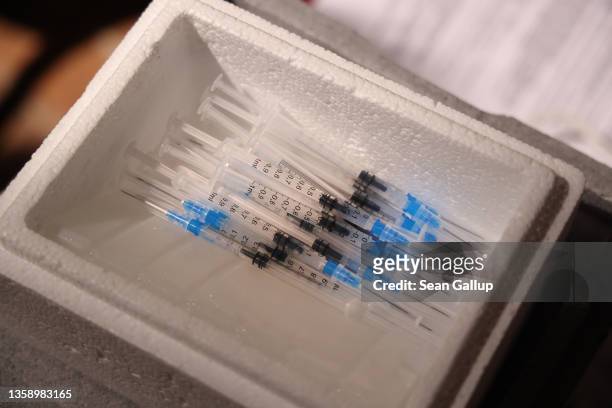 Syringes filled with the Pfizer/BioNTech vaccine against Covid-19 lie in a styrofoam dish during a vaccination drive inside 16th-century Sankt...