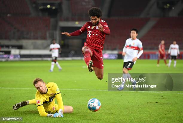 Serge Gnabry of FC Bayern Muenchen evades a tackle from Florian Mueller of VfB Stuttgart during the Bundesliga match between VfB Stuttgart and FC...