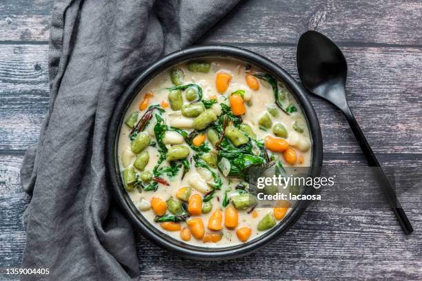 bowl of small colourful gnocchi with chard - eintopf stock-fotos und bilder