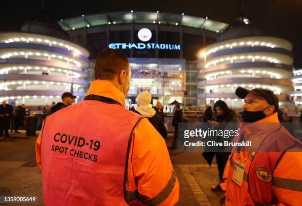 Covid-19 spot checker is seen outside the stadium prior to the Premier League match between Manchester City and Leeds United at Etihad Stadium on...