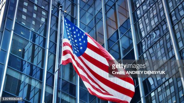 american business. american flag, modern financial building, conceptual view. - american flag jpg stock pictures, royalty-free photos & images