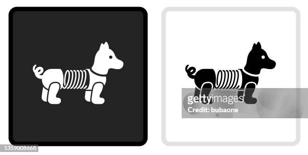 slinky dog toy icon on  black button with white rollover - slinky stock illustrations