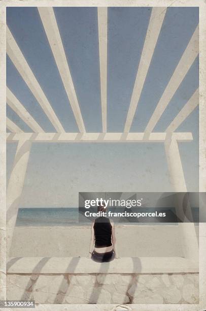 woman sitting on beach - granada spain stock pictures, royalty-free photos & images