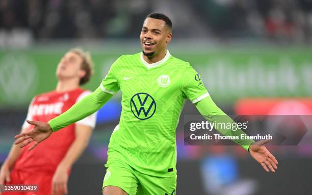 Lukas Nmecha of VfL Wolfsburg celebrates after scoring their side's first goal during the Bundesliga match between VfL Wolfsburg and 1. FC Köln at...