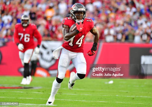 Chris Godwin of the Tampa Bay Buccaneers runs with the ball during the first half against the Buffalo Bills at Raymond James Stadium on December 12,...