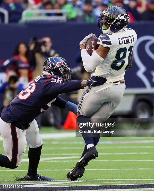 Seattle Seahawks tight end Gerald Everett catches a pass as Houston Texans middle linebacker Christian Kirksey make the tackle at NRG Stadium on...