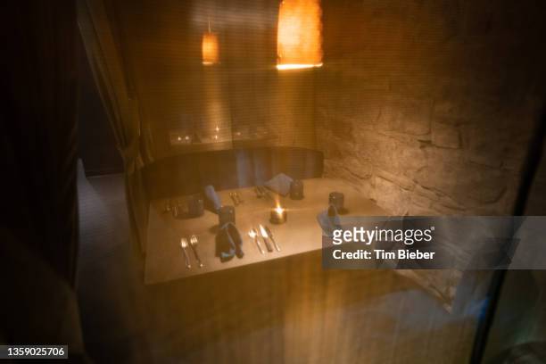 looking through a textured curtain at a table setting in a restaurant - speakeasy interior stock pictures, royalty-free photos & images