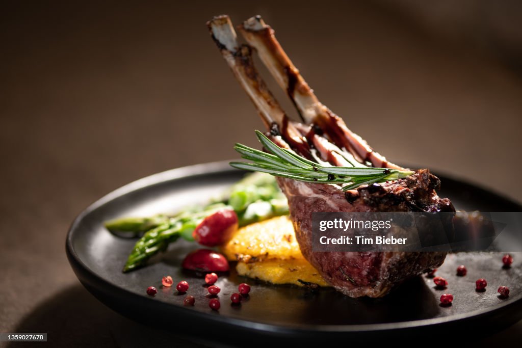 A rack of two grilled French cut lamb chops.