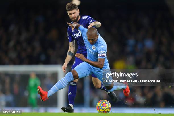 Fernandinho of Manchester City battles for possession with Mateusz Klich of Leeds United during the Premier League match between Manchester City and...