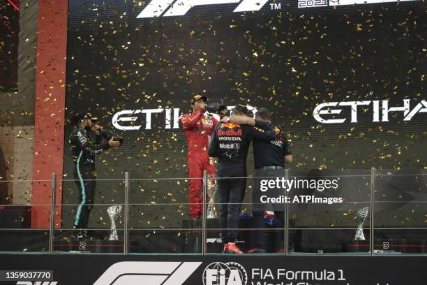 Title celebration on the podium, , MAX Verstappen, Carlos Sainz Jr. And Christian Horner during the Grand Prix Formula 1 of Abu Dhabi, at Yas Marina...