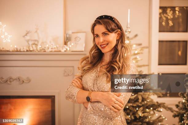 it's most wonderful time of the year - christmas party dress stockfoto's en -beelden