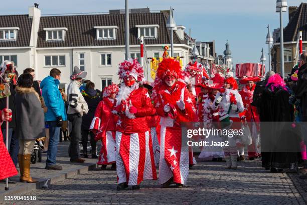 group of cheerful women walking along in a dutch carnaval parade (2013) - carnaval limburg stock pictures, royalty-free photos & images