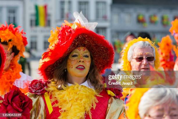 enthusiastic woman walking along in the maastricht carnaval parade - carnaval limburg stock pictures, royalty-free photos & images