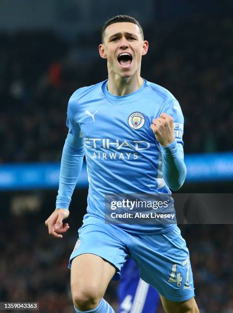 Phil Foden of Manchester City celebrates after scoring their side's first goal during the Premier League match between Manchester City and Leeds...