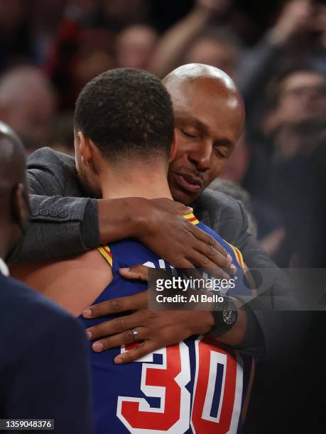 Stephen Curry of the Golden State Warriors hugs Ray Allen after making a three point basket to break Allen’s record for the most all-time against the...