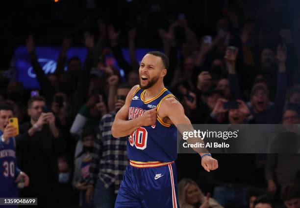 Stephen Curry of the Golden State Warriors celebrates after making a three point basket to break Ray Allen’s record for the most all-time against the...