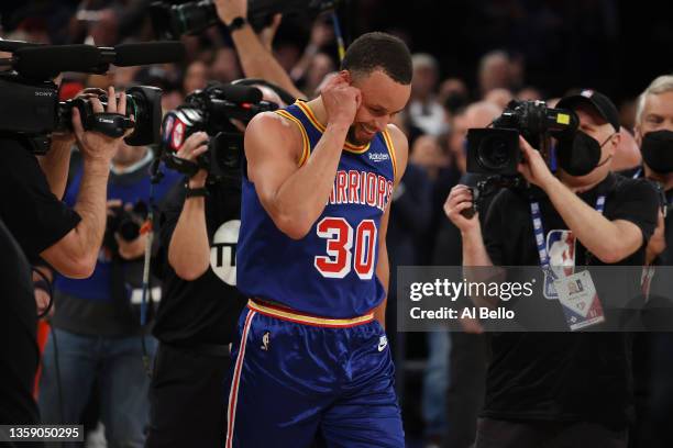 Stephen Curry of the Golden State Warriors looks on after making a three point basket to break Ray Allen’s record for the most all-time against the...