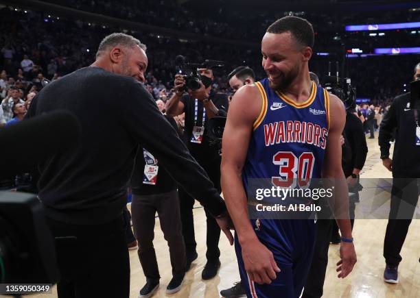 Stephen Curry of the Golden State Warriors hugs his Dad Dell Curry after making a three point basket to break Ray Allen’s record for the most...