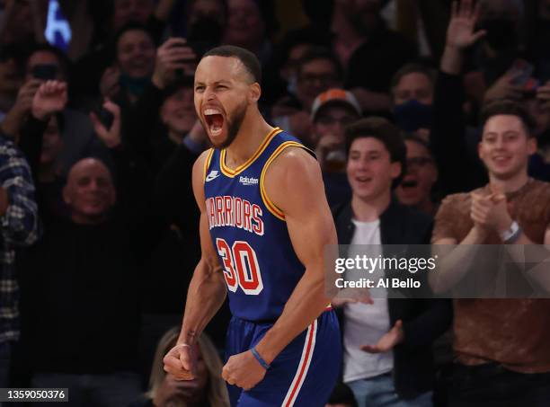 Stephen Curry of the Golden State Warriors celebrates after making a three point basket to break Ray Allen’s record for the most all-time against the...