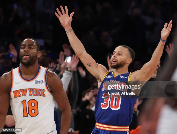 Stephen Curry of the Golden State Warriors celebrates after making a three point basket to break Ray Allen’s record for the most all-time as Alec...