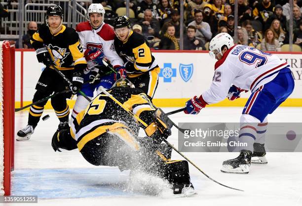 Jonathan Drouin of the Montreal Canadiens scores a goal past Tristan Jarry of the Pittsburgh Penguins during the second period of a game at PPG...