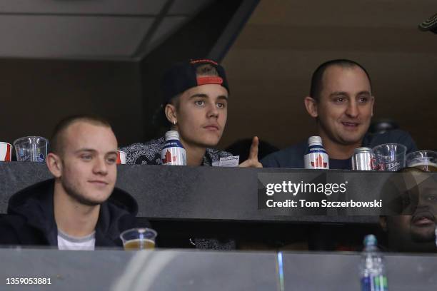 Pop star Justin Bieber attends the Toronto Maple Leafs NHL game against the Carolina Hurricanes at Air Canada Centre on December 29, 2013 in Toronto,...