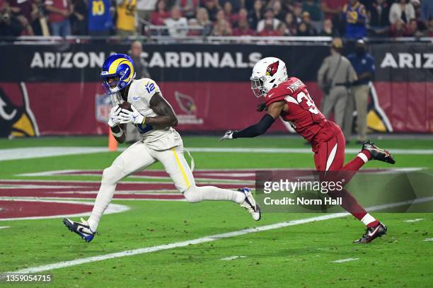 Van Jefferson of the Los Angeles Rams catches a touchdown pass while being defended by Jalen Thompson of the Arizona Cardinals at State Farm Stadium...