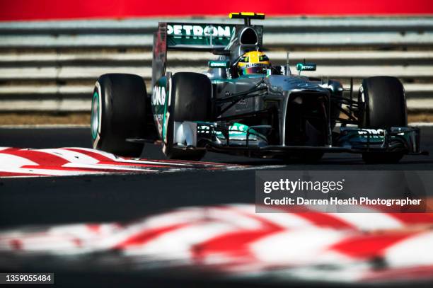 British Mercedes Formula One team racing driver Lewis Hamilton driving his F1 W04 racing car at speed through Turn Six of the circuit during the 2013...