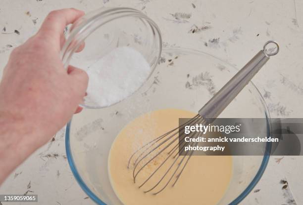 crème anglaise preparation - hand holding whisk stock pictures, royalty-free photos & images