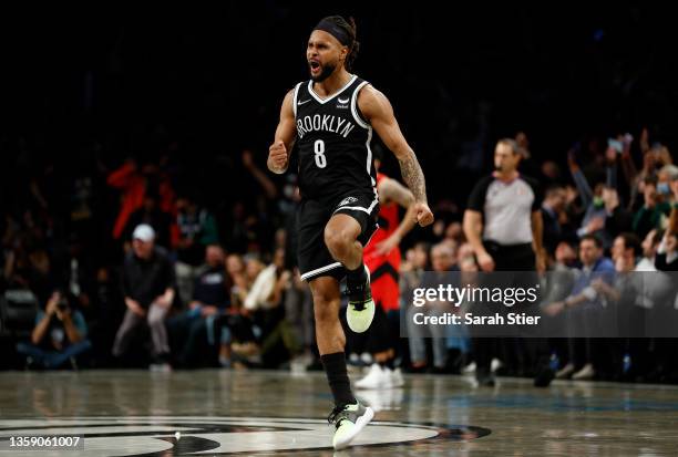 Patty Mills of the Brooklyn Nets reacts after making a three-point basket during the second half against the Toronto Raptors at Barclays Center on...