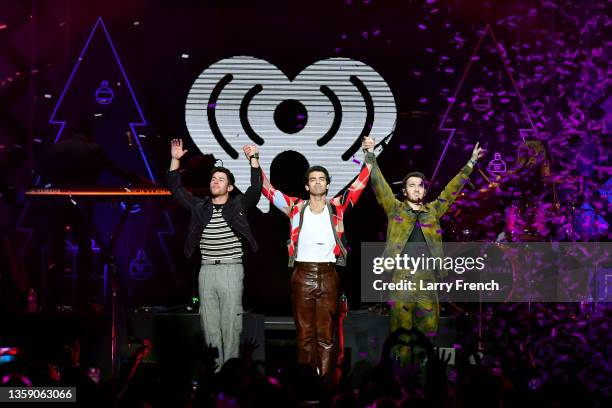 Nick Jonas, Joe Jonas, and Kevin Jonas of Jonas Brothers perform onstage during iHeartRadio Hot 99.5's Jingle Ball 2021 Presented by Capital One at...