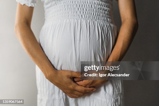 Portrait Of A Pregnant Belly High-Res Stock Photo - Getty Images