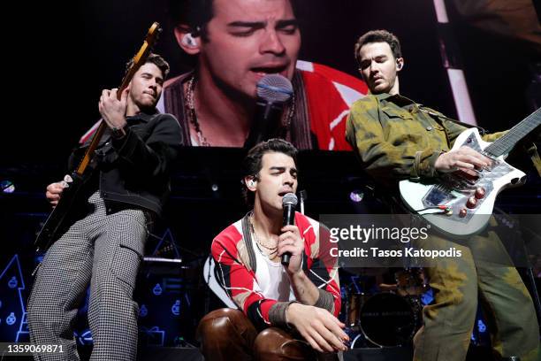 Nick Jonas, Joe Jonas, and Kevin Jonas of Jonas Brothers perform onstage during iHeartRadio Hot 99.5's Jingle Ball 2021 Presented by Capital One at...