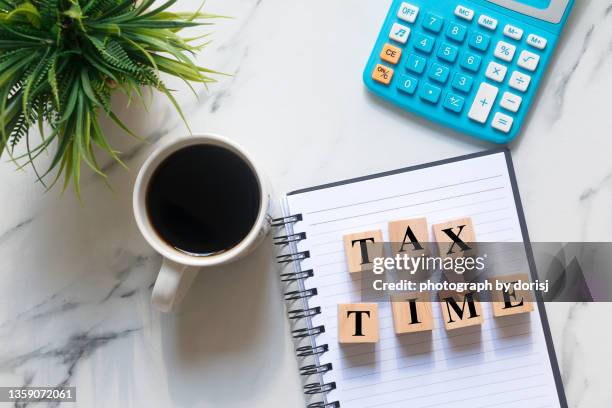 tax time words on wood block - tax time stock pictures, royalty-free photos & images