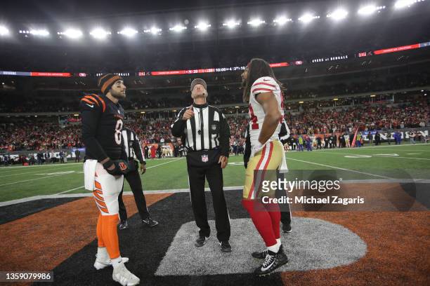 Captains of the San Francisco 49ers and the Cincinnati Bengals at midfield during the coin toss before the start of overtime of the game at Paul...