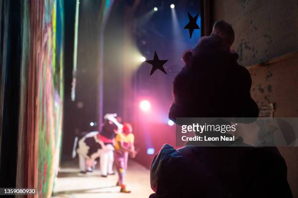 Clive Rowe prepares to return to the stage as "Dame Trot" following a costume change during an evening performance of "Jack and The Beanstalk"...