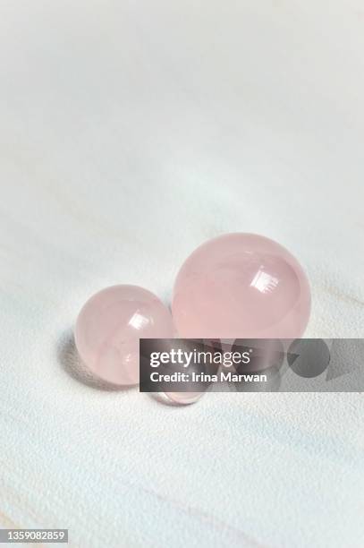 rose quartz crystal sphere ball - rose quartz stock pictures, royalty-free photos & images