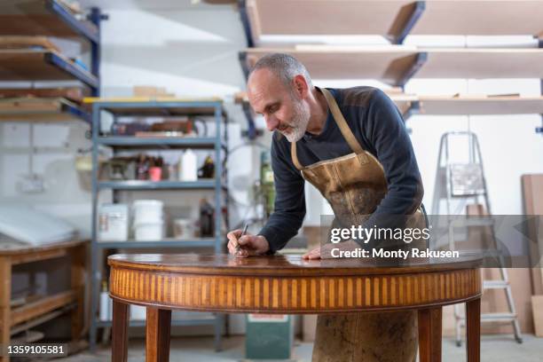 uk, darlington, restorer working on 18th century marquetry side table - marquetry stock pictures, royalty-free photos & images