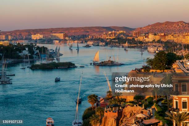 sailboats on nile river, aswan, egypt - nile river stock-fotos und bilder