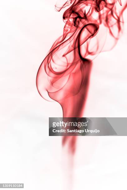 red smoke spirals - wispy stock pictures, royalty-free photos & images