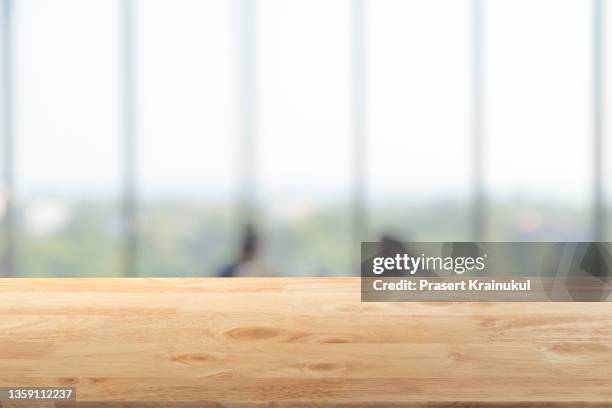 empty wood table top, counter, desk background with blurred window background - mesa imagens e fotografias de stock