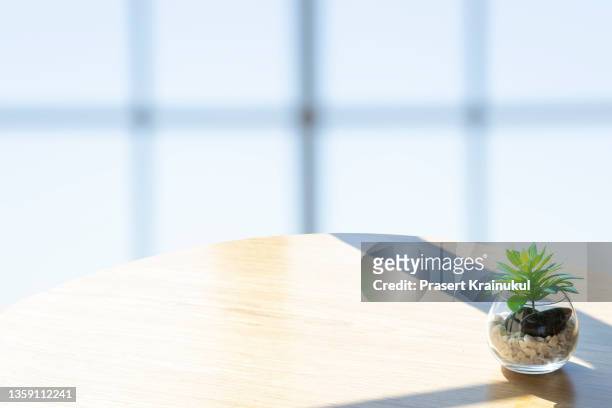empty wood table top, counter, desk background with blurred window background - empty board room stock pictures, royalty-free photos & images