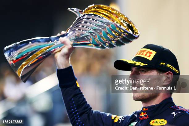 Max Verstappen of the Netherlands and Red Bull Racing celebrates on the podium after winning the Formula 1 World Championship and F1 Grand Prix of...