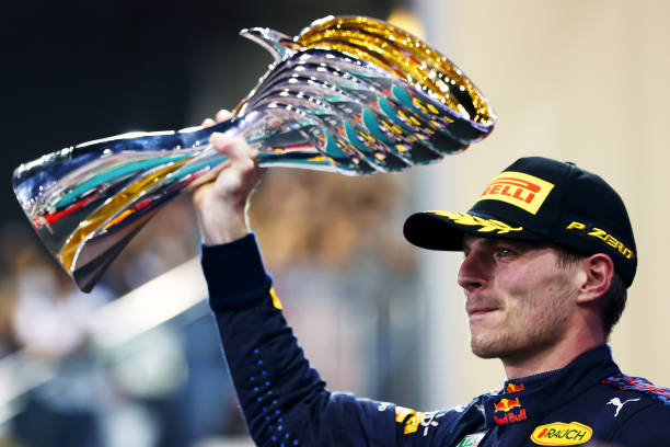 Verstappen hoisting the trophy after winning the 2021 Abu Dhabi Grand Prix (Image Credit: Dan Istitene / Getty Images)