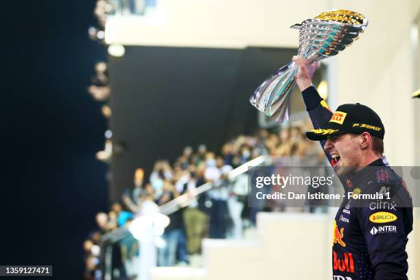 Max Verstappen of the Netherlands and Red Bull Racing celebrates on the podium after winning the Formula 1 World Championship and F1 Grand Prix of...