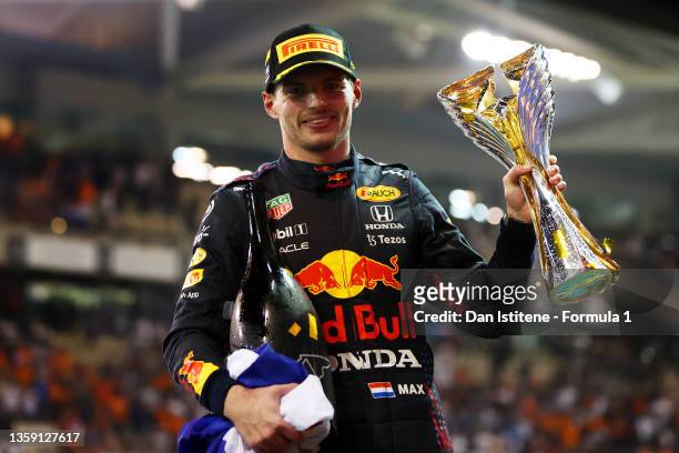 Max Verstappen of the Netherlands and Red Bull Racing celebrates on the podium after winning the Formula 1 World Championship and F1 Grand Prix of...