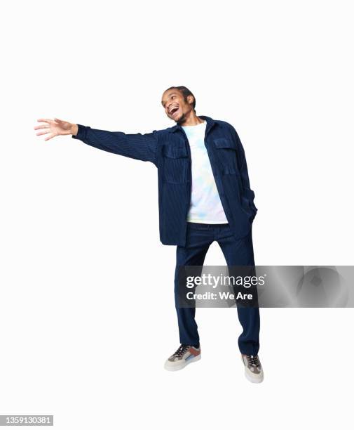 young man reaching in studio - reiken stockfoto's en -beelden